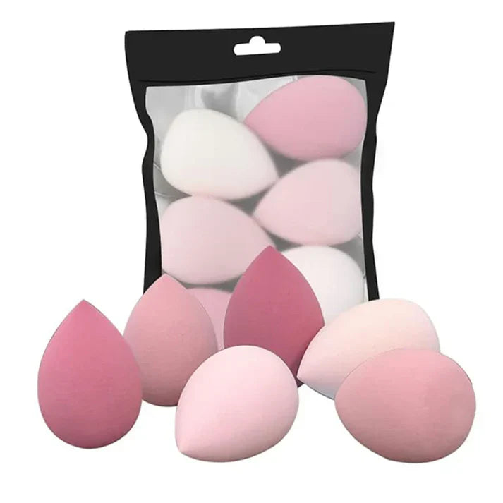 Renlys – Profesjonell Makeupsvamp i pakke med flere rosa og hvite makeupsvamper for enkel påføring av sminke.