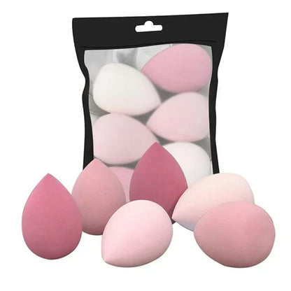 Renlys – Profesjonell Makeupsvamp i pakke med flere rosa og hvite makeupsvamper for enkel påføring av sminke.